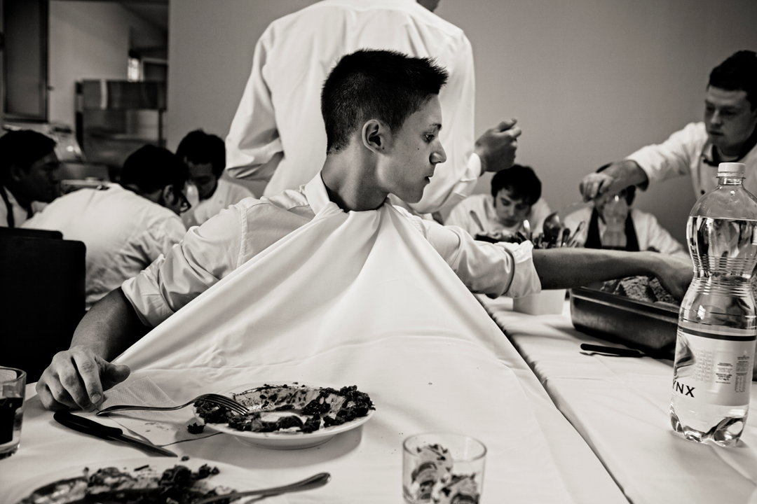 A waiter keeps his shirt clean for service. Osteria Francescana, Modena, Italy. Photo by Per-Anders Jörgensen