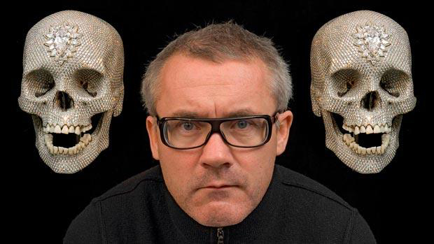 Damien Hirst pictured with two images of For The Love Of God (2007). Or is it Mick and Keith?