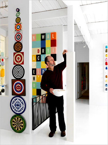 Coupland builds Lego around one of his second home's pillars. Photo by Martin Tessler