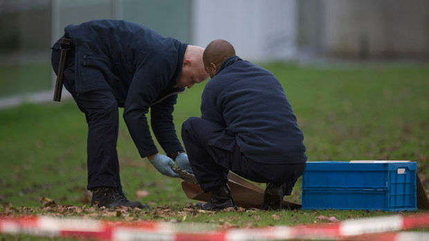 Police make a search of the museum grounds the day after the theft in October