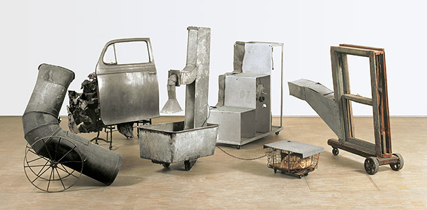 Oracle, 1962-65 - Five-part found metal assemblage with five concealed radios: ventilation duct; car door on typewriter table, with crushed metal; ventilation duct in washtub and water, with wire basket; constructed staircase control unit housing batteries and electronic component; and wooden window frame with ventilation duct